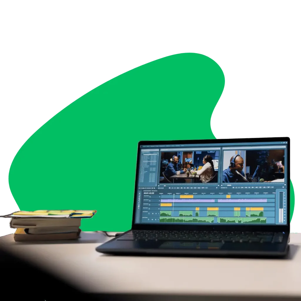 : A laptop screen shows video editing software with multiple tracks, waveforms, and video previews of people recording, illustrating the meticulous process of video production and post-production services.
