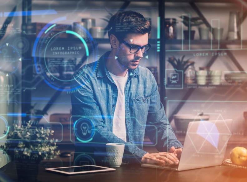 a man on his laptop checking the best AI marketing services